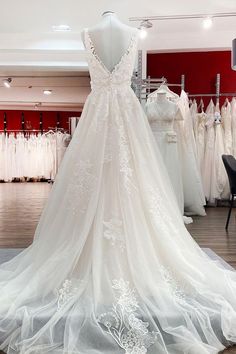 a wedding dress on display in a store