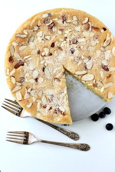 a pie with almonds and blueberries on top