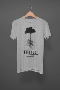 "DESCRIPTION Celebrate your rootedness and proclaim His trustworthiness with our 'Rooted: Jeremiah 17:7-8' design. \"Blessed is the man who trusts in the LORD, whose trust is the LORD.  He is like a tree planted by water, that sends out its roots by the stream, and does not fear when heat comes, for its leaves remain green, and is not anxious in the year of drought, for it does not cease to bear fruit.\" TO PURCHASE Choose your size in the drop down Choose your quantity Click 'Buy It Now' Choose Faith Over Fear Shirt, Gifts Christian, Faith Over Fear, Do Not Fear, Great T Shirts, Christian Shirts, Christian Gifts, Columbus, Trees To Plant