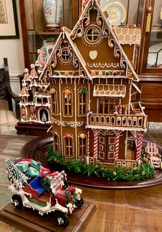 a gingerbread house is on display in a store