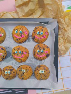 there are chocolate chip cookies with faces painted on them