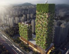 an aerial view of a city with tall buildings covered in green plants and vertical trees