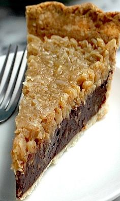 a piece of pie sitting on top of a white plate