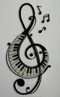 a music note with musical notes on it's side and black metal wire hanging from the wall