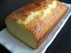 a loaf of cake sitting on top of a white plate