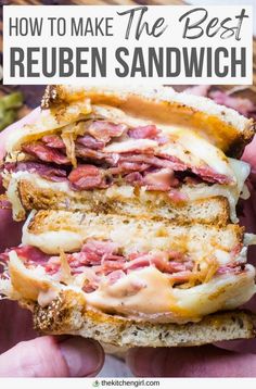 someone holding up a sandwich with meat and cheese on it in their hands, text overlay reads how to make the best reuben