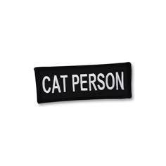 a black and white patch with the words cat person on it