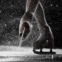 a person's feet with snow falling on them