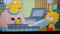 the simpsons is sitting in front of a laptop computer and talking to another person who is looking at it