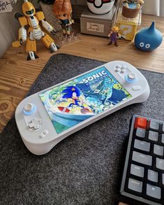 a nintendo wii game system sitting on top of a table next to a remote control