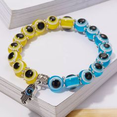 Elastic Rope Chain Bead Bracelet. Weight 13g Blue & Yellow Evil Eye Bracelet Bohemian Blue Charm Bracelet With Colorful Beads, Adjustable Yellow Beaded Crystal Bracelet, Yellow Beaded Spiritual Bracelets, Adjustable Blue Charm Bracelet With 8mm Beads, Yellow Beaded Charm Bracelet For Gift, Adjustable Beaded Yellow Crystal Bracelet, Yellow Beaded Charm Bracelet Gift, Blue Charm Bracelet With Letter Beads, Blue Charm Bracelet With Letter And Round Beads