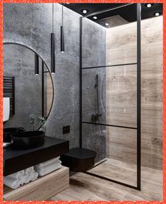 a modern bathroom with black and white accessories