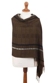 The rich warmth of chestnut brown brings its fascination to this beautiful shawl by Wilmer Vilchez. Woven by hand its large windowpane motifs add visual interest with rows that mingle black and white. Baby alpaca refers to the fine fleece from the season's first shearing. Brown Alpaca Shawl For Fall, Brown Alpaca Shawl, Brown Shawl Wrap For Fall, Brown Winter Shawl Wrap, Fall Brown Shawl Wrap, Brown Scarf Wrap For Fall, Brown Fall Scarf Wrap, Alpaca Brown Shawl For Winter, Brown Alpaca Shawl For Winter