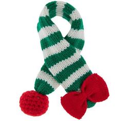 Size: Extra Small/Small Dimensions: 17" x 2" Material: Fabric Color: Green, White & Red Pattern: Stripes Quantity: 1 Care: Machine Wash, Cold, Gentle Cycle Only Non-Chlorine Bleach When Needed Reshape Lay Flat To Dry Dress your dog for the season in this adorable Striped Knitted Dog Scarf! This cute scarf features a trendy cable knit look and a festive striped design. At one end is a tiny knit bow, and at the other end is a matching knit ball. On the back of the scarf is a fabric loop you can push the ball end through, allowing the scarf to easily hold around your pup's neck. Use this scarf to delight your guests with a well dressed pet this holiday season! Knitted Dog, Cute Scarf, Knit Bow, Green White Red, Cute Scarfs, Dog Scarf, Dog Scarfs, Red Pattern, Christmas Jewelry