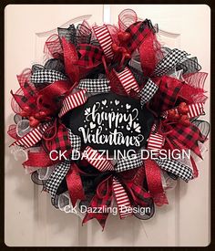 a red and black happy valentine's day deco mesh wreath with the words c k bazing design on it