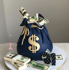 a blue bag with money is sitting on a plate