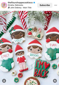 christmas cookies decorated like elfs on a table