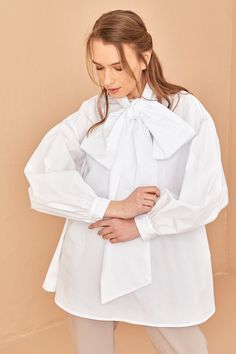 100% cotton houte couture shirt Shirt length: 80 cm Model height: 177 White Blouse With Tie Sleeves For Daywear, White Bow Blouse For Workwear, White Bow Blouse For Work, Chic Tops With Detachable Bow For Spring, Chic Bow Tie Blouse For Spring, Chic Spring Blouse With Bow Tie, Chic White Blouse With Bow Detail, Chic White Blouse With Bow, White Fall Blouse With Bow