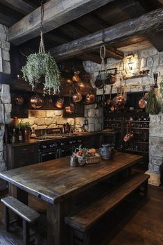 a rustic kitchen with wooden tables and hanging pots