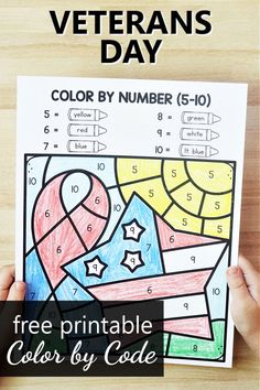 the veterans day color by number printable for kids is shown in front of a wooden table