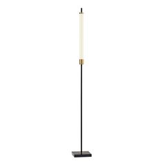 a black and gold floor lamp with a white light on the top, standing in front of a white background