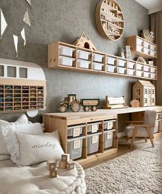 a child's bedroom with lots of toys on the shelves