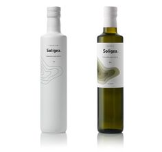 two bottles of olive oil are shown side by side, one is white and the other is green