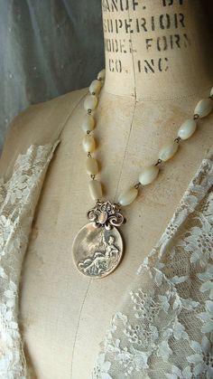 Antique mother of pearl and bronze medal necklace. CobwebPalace on Etsy. Neck Art, Vintage Upcycling, Urban Barn, Assemblage Necklace, Vintage Repurposed, Flower Quilt, Necklace Ideas, Barn Ideas, Bohemian Handmade