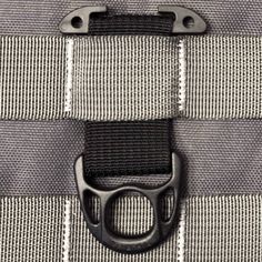 a close up view of the zipper on a bag with black buckles and white stripes