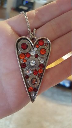 Fire Bullet Heart NecklaceHandmade itemMaterials: nickle plated brass, nickle plated bullet, swarovski crystal Magnetic Bracelets, Jewelry Wood, Bullet Casing, Bullet Jewelry, Magnetic Bracelet, Leather Earrings, Heart Necklace, Swarovski Crystal, Swarovski Crystals