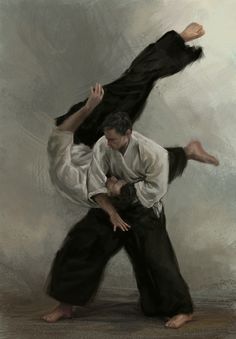 two people in black and white are doing karate