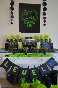 a gaming themed party with neon green and black decorations