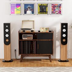 an entertainment center with speakers and record players