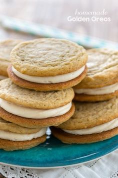 cookies with white frosting on a blue plate