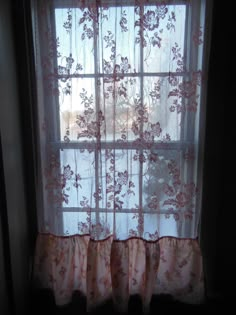 the curtains are hanging in front of the window sill, and it looks like they have been made out of sheer fabric