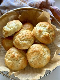 a bowl filled with biscuits on top of a table