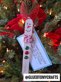 a christmas ornament hanging from a tree