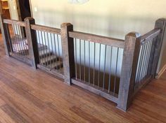 two wooden baby gates sitting on top of a hard wood floor