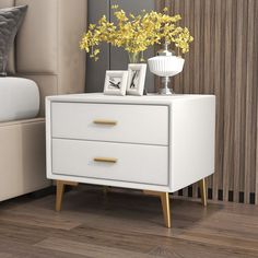 a white nightstand with yellow flowers on top