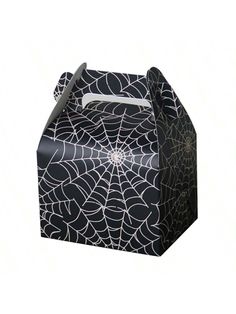 a black and white spider web treat box