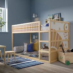 a child's bedroom with bunk beds and toys on the floor in front of it