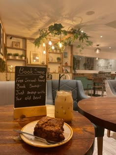 a table with a plate of food and a drink on it