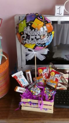 a desk with candy, candies and a computer