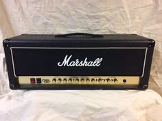 the marshall amp is sitting on a white sheet