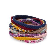 multicolored bracelets stacked on top of each other