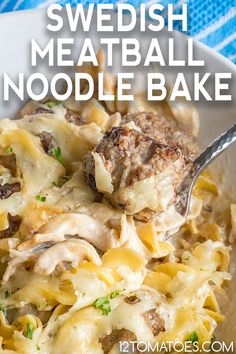 swedish meatball noodle bake in a white bowl with a spoon and blue towel