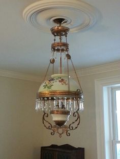 a chandelier hanging from the ceiling in a room