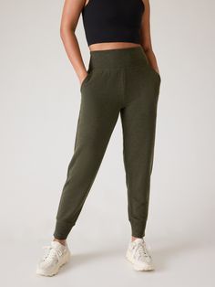 FOR: Restoration and rejuvenation FEEL: Super-soft Brushed Nirvana is extra cozy FAVE: A wide, ribbed waistband provides support and comfort Easy-access pockets to stash your essentials Relaxed with room to move Sits at the natural waist Inseam: Regular: 25.5". Olive Green Pants, Bra Dress, Girl Online, Green Pants, Athleta Pants, Swim Accessories, Bottom Clothes, Heather Black, Petite Size