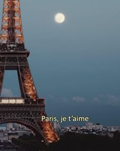 the eiffel tower lit up at night in paris, france with text overlay