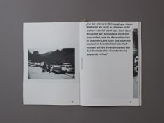 an open book with black and white photos on it's cover, showing the inside pages